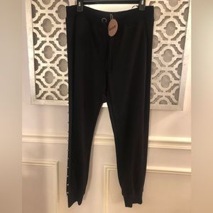 Essue black joggers with side stud detail